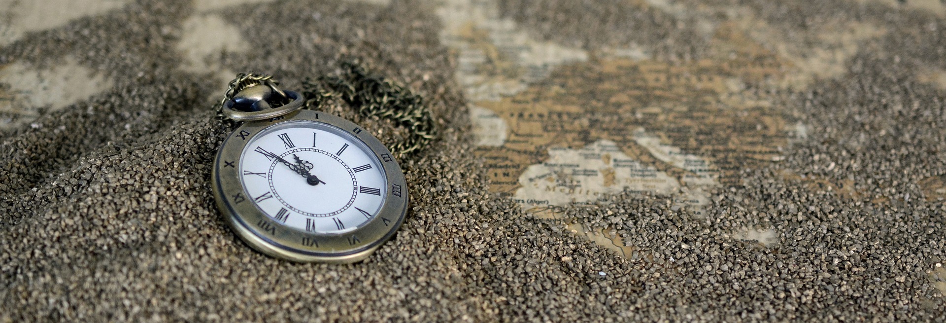A pocket watch resting on a surface, symbolizing the passage of time